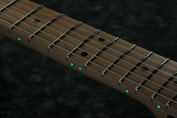 Luminescent side dot inlay